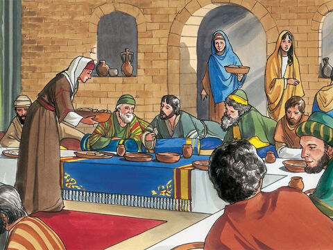Ali prepararam um jantar para Jesus. Marta servia, enquanto Lázaro estava à mesa com ele. – Slide número 2