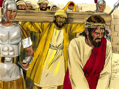 Jesus estava fraco por causa das surras e caiu. Os soldados agarraram um homem na multidão, Simão de Cirene, cidade do norte da África, ... e forçaram-no a carregar a cruz. – Slide número 2