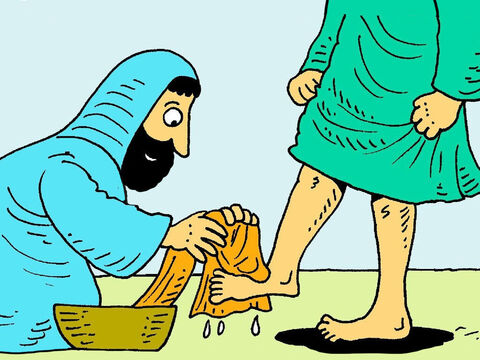Jesus se ajoelhou e começou a lavar gentilmente os pés sujos deles e os secava com uma toalha. – Slide número 4