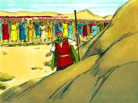 Os líderes seguiram Moisés até a rocha no Horebe e viram quando ele a golpeou com seu cajado. – Slide número 30