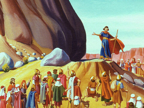 Moisés obedeceu e reuniu todos diante de uma grande rocha fora do acampamento. Depois ele bateu na rocha com a sua vara. – Slide número 9
